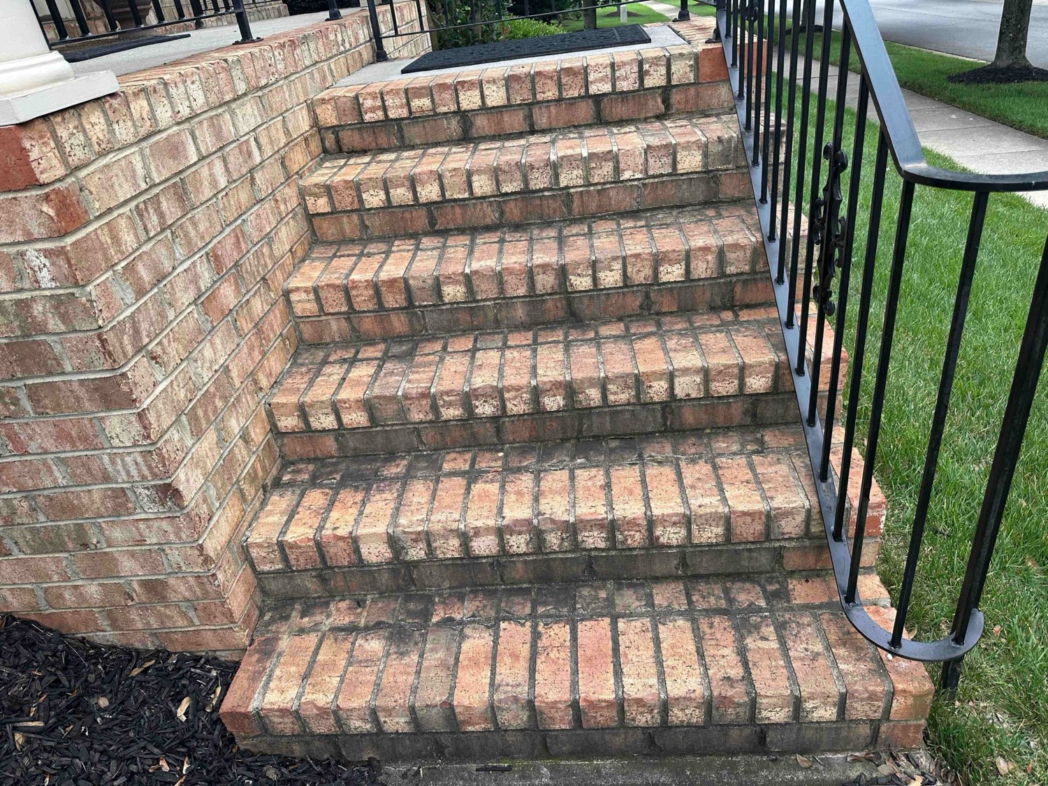 A freshly cleaned red-brick front staircase on a sunny day in Charlotte, NC